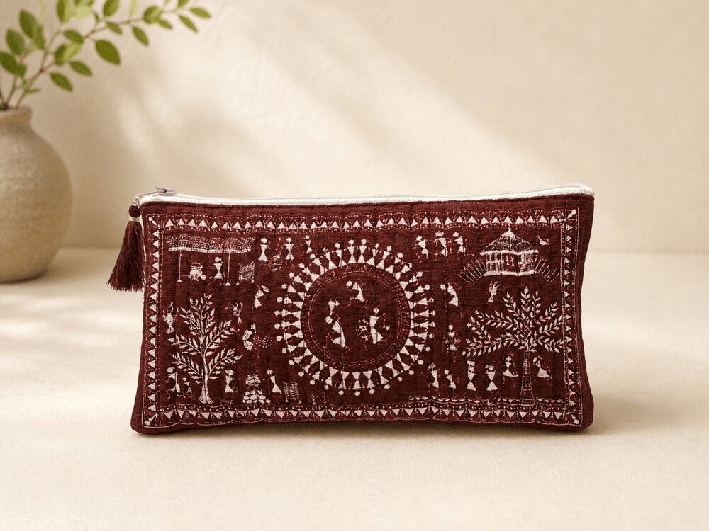 Maroon Warli art pencil pouch with a white village scene